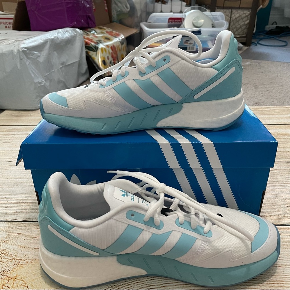 White and blue Adidas ZX 1K athletic shoes
